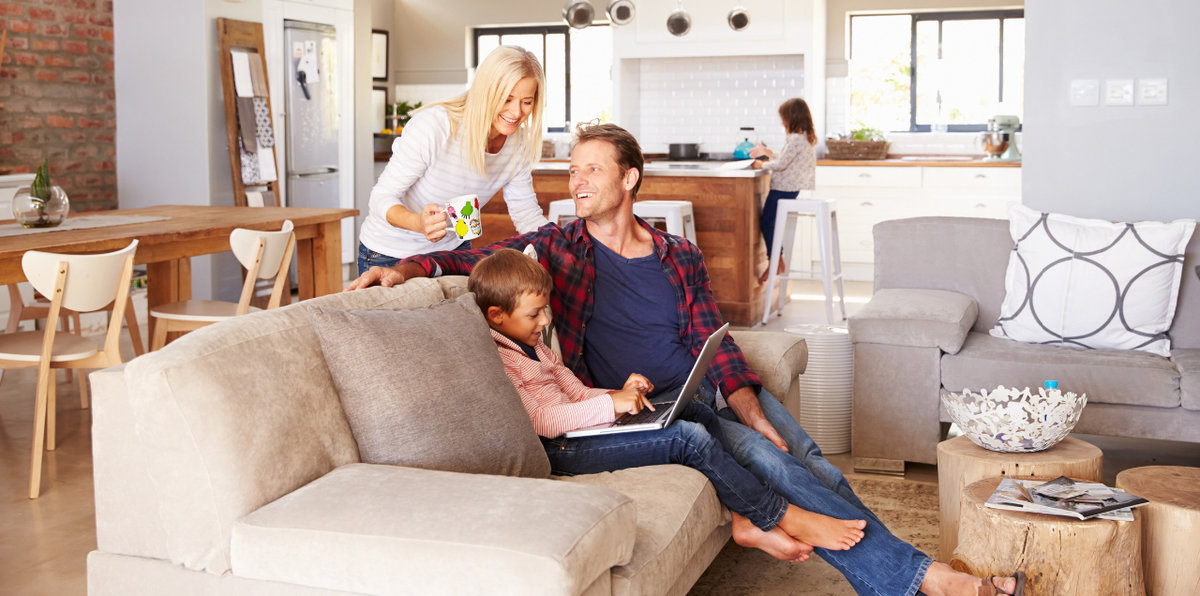 Family staying comfortable and cool indoors on a hot day with the help of their reliable air conditioning unit.
